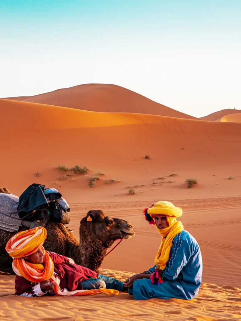 Diverse Moroccan landscapes Sahara Desert dunes and vibrant Marrakesh medina, inspiring a comprehensive Morocco itinerary.