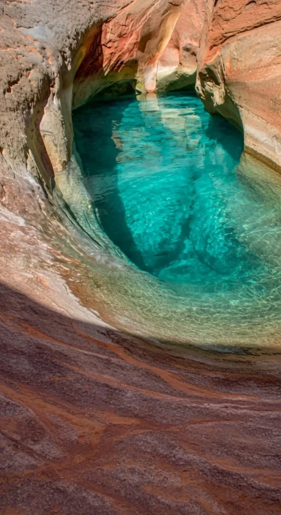 Stunning emerald pools surrounded by palm trees in Morocco's Paradise Valley