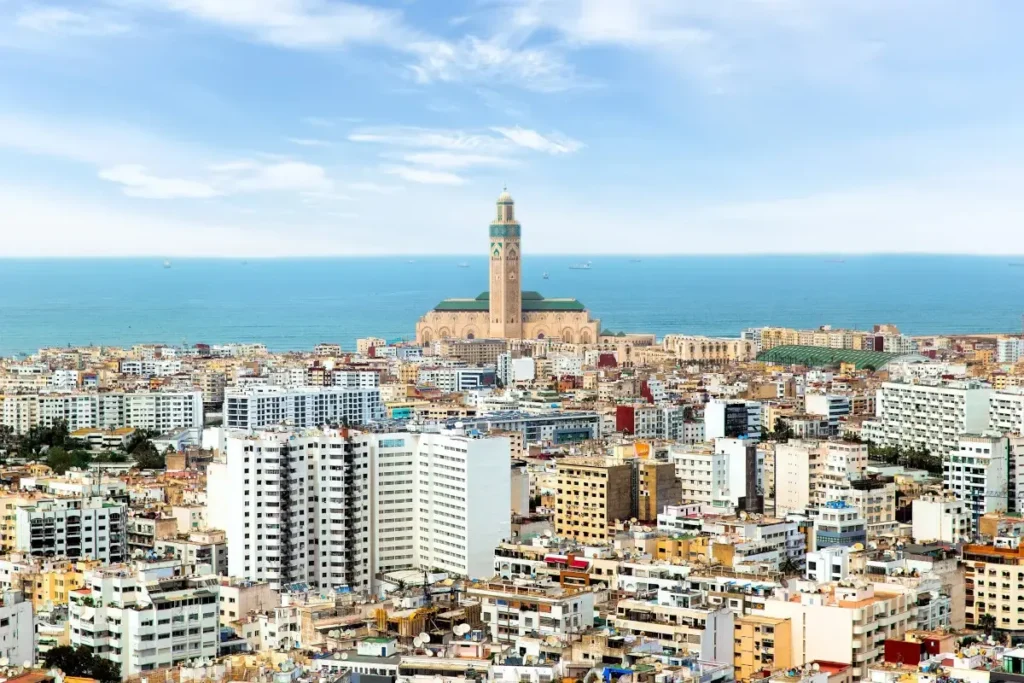 The majestic Hassan II Mosque in Casablanca, featuring a 210m minaret and oceanfront location, a top cultural site for Morocco vacation packages.