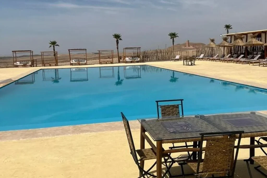 Inside a suite at a premier Agafay desert luxury camp with private pool view.