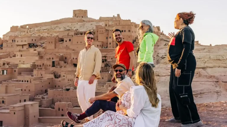 Professional guide for travel to morocco from australia featuring a sunset marketplace.